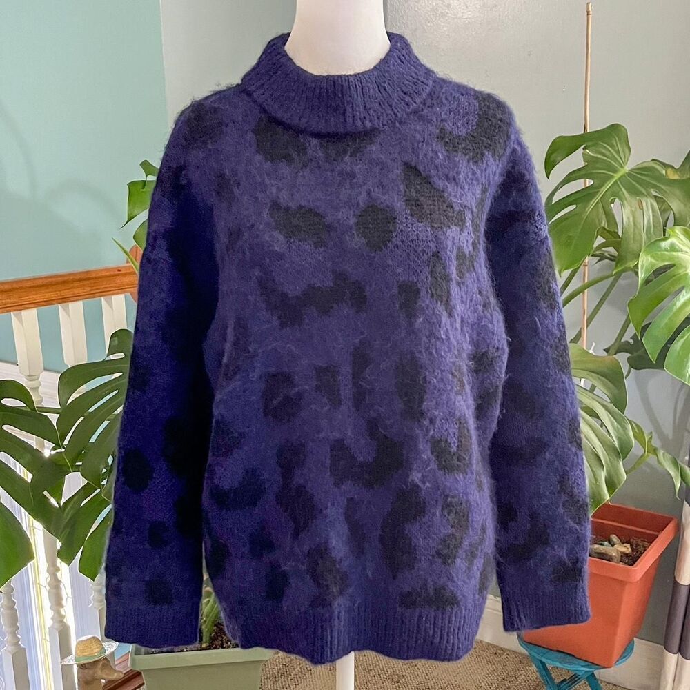 Kate Spade soft and warm blue and black leopard print sweater with a mock neck.